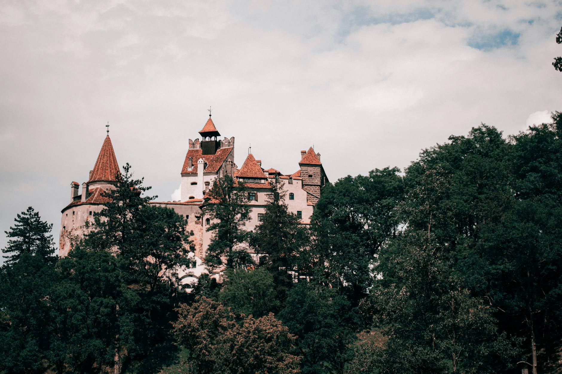 Bran Castle in Transylvania, Romania, set against forested hills